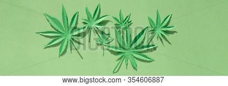 Cannabis Leaf Made Of Paper On Green Background