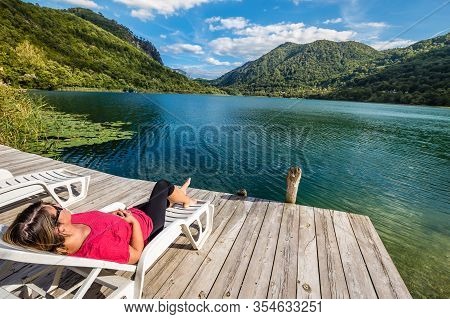 A Girl Relaxing On Pier By Boracko Lake - Konjic, Bosnia And Herzegovina, Europe