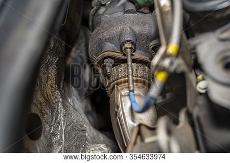 Turbocharger In A Used Car With A Diesel Engine Visible Engine Compartment Covered With Aluminum Foi