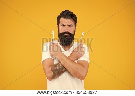No Toothache. Bearded Man Hold Toothbrushes. Hipster With Tooth Brushes. Teeth Care. Oral Hygiene. D