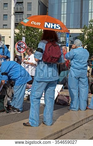 Bristol, Uk - July 8, 2015: Protestors Wearing Scrub Suits Prepare For An Anti-austerity Demonstrati