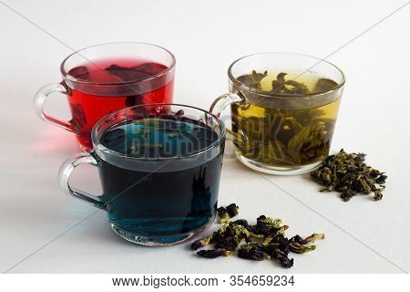 Butterflu Pea Tea. Blue Herbal Hot Tea. Three Glass Cups With Blue, Red And Green Tea With Dry Tea L