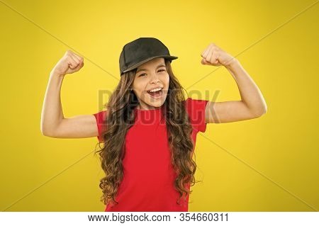 Girl Long Curly Hair Wear Cap. Must Have Street Style Accessory Trends. Modern Fashion. Kids Fashion
