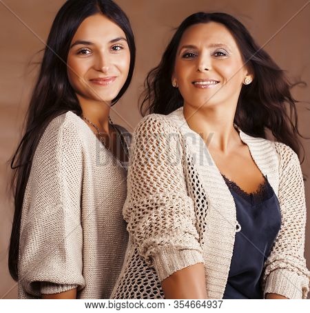 Cute Pretty Teen Daughter With Mature Mother Hugging, Fashion Style Brunette Makeup Close Up Tann To