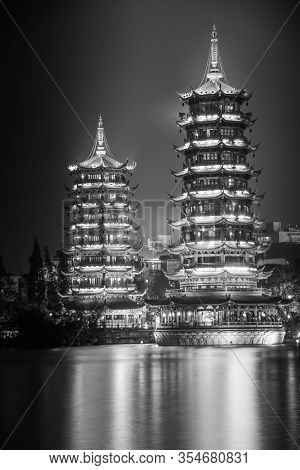 Guilin, China - May 9, 2010: Riyue Shuangta Cultural Park. Black And White Portrait Of Twin Pagodas 