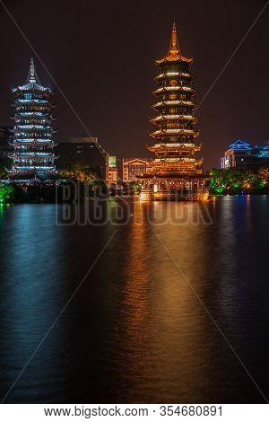Guilin, China - May 9, 2010: Riyue Shuangta Cultural Park. Portrait Of Twin Pagodas In Shanhu Lake, 