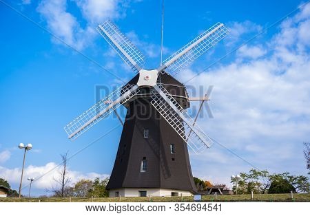 Osaka, Japan - December 12 2019 : Tsurumi Ryokuchi Park Windmill, Medium Shot, Low Angle View