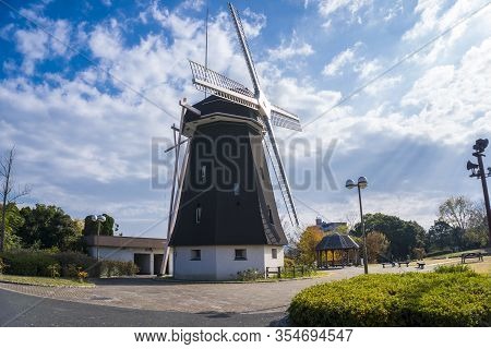 Osaka, Japan - December 12, 2019: Tsurumi Ryokuchi Park Windmill, Medium Shot, Eye Level View