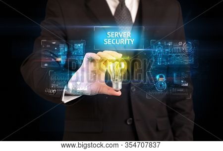 Businessman holding lightbulb with SERVER SECURITY inscription, online security idea concept