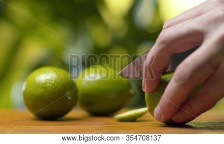 Male Hand Cutting Lime