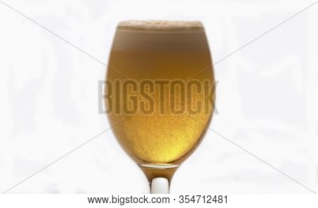 Beer Into Transparent Glass, Froth And Bubbles