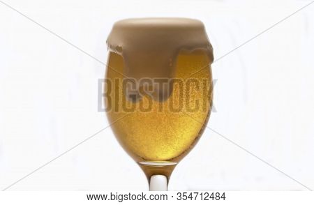 Beer's Froth Rising In A Glass