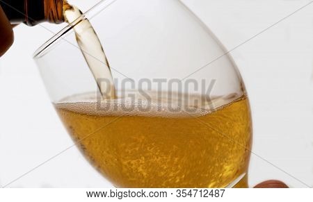 Beer Pouring Into A Glass