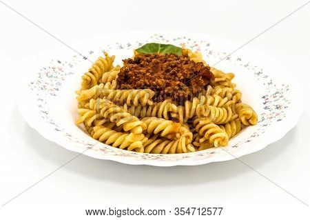 Spirelli With Bolognese Sauce On A White Background