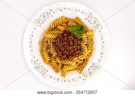 Spirelli With Bolognese Sauce On A White Background