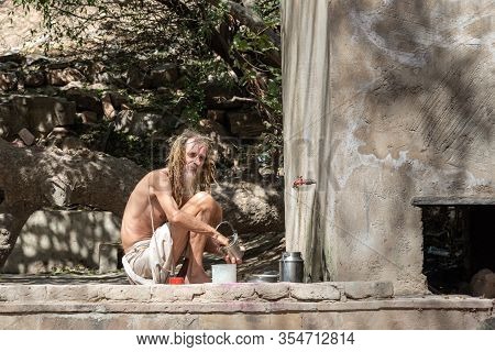 Barsana, Uttar Pradesh, India - March 22, 2019: Foreign Sadhu Holy Man Near Shri Radha Sarovar Is Ho