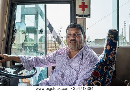 Mathura, Uttar Pradesh, India - March 22, 2019: Portrait Of Indian Driver Man On Bus