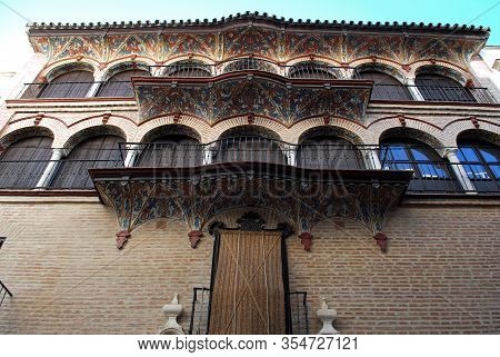 Arched Windows And Ornate Frescoes On The Front Of The Silk Guild House (casa Del Gremio De La Seda)