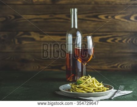 Gray Plate Of Spaghetti Pasta Bucatini With Pesto Sauce And Parmesan. Italian Traditional Perciatell
