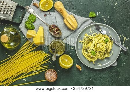 Gray Plate Of Italian Traditional Perciatelli Pasta By Genovese Pesto Sauce Served With Ingredients 