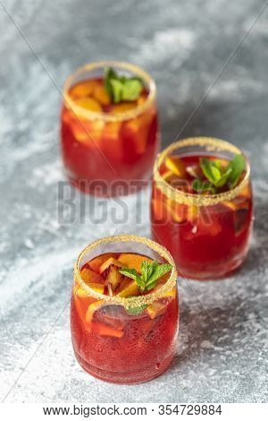 Three Glasses Of Campari Gin Spritz. Cocktail Of Sweet, A Touch Of Bitter From The Campari And Gorge