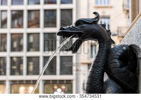 The Fountain Called Escalade, Water Spouts In The Fountain Through Bronze Dragon, Close-up, Geneva, 