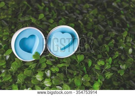 Focusan Easter Egg With A Heart Inside On The Grass. Eater Egg, Sign Of Easter S Day Festival. Close