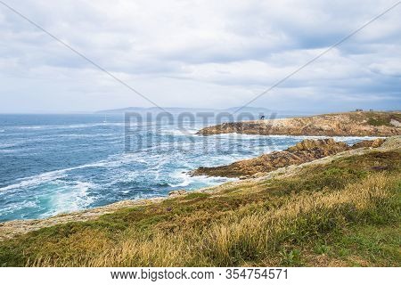 A Coruna, Spain - July 25, 2019: Landscape Of The Atlantic Ocean With The Sculpture Of The Caracola 