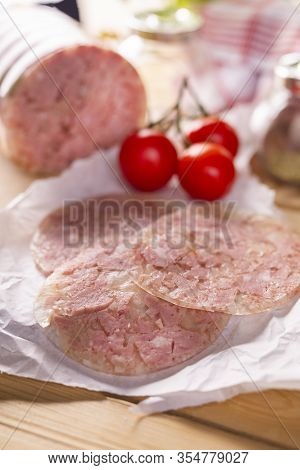 Sliced Headcheese On A Paper. Brawn. Pork Cold Cuts.