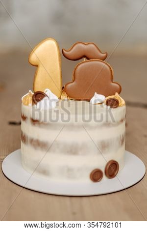 First Birthday Biscuit Cake Decorated Sweet Cookie, Meringue And Chocolate Buttons On Top Closeup. F