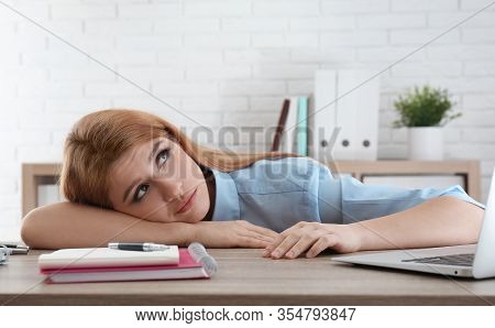 Lazy Employee Wasting Time At Table In Office
