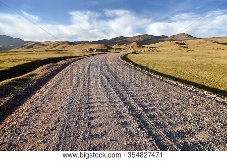 Unpaved Road And Yurts Near Son-kul Lake And Tian Shan Mountains In Kyrgyzstan