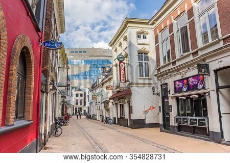 Groningen, Netherlands - March 07, 2020: Historic Street With Bars And Pubs Leading To The Forum In 