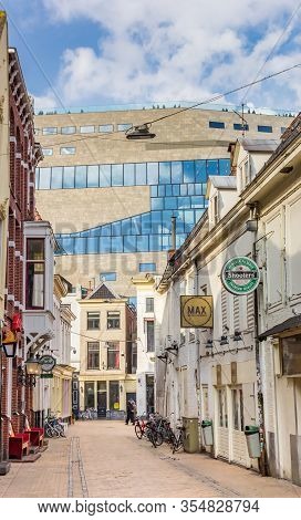 Groningen, Netherlands - March 07, 2020: Historic Street With Bars And Pubs Leading To The Forum In 