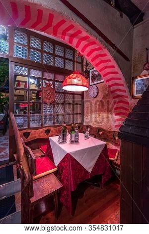 MALCESINE, ITALY, JUNE 20, 2017: INTERIOURS OF STREET RESTAURANTS AT NIGHT IN THE CENTRE OF MALCESINE.