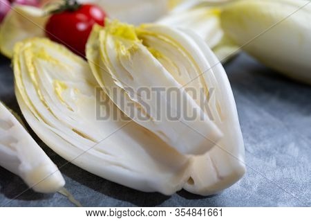 Fresh Belgian Endive Or Chicory Bitter Salad Ready To Cook Or Eat Close Up