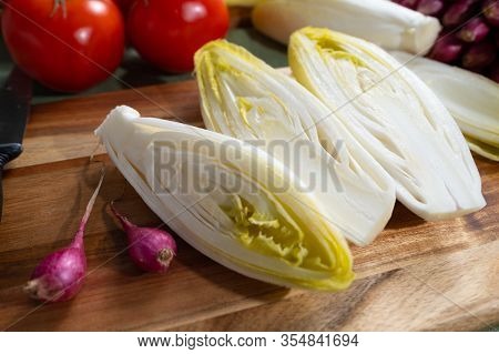Fresh Belgian Endive Or Chicory Bitter Salad Ready To Cook Or Eat Close Up