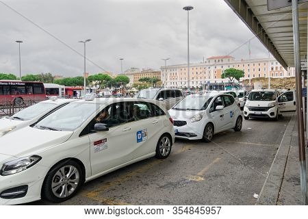 Rome, Italy - November 21 2019: Taxi Stand At Termini Railway Station. White Taxis In Front Of The M