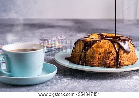Cup Of Black Coffee And Cake With Pouring Chocolete, Blurred Bokeh Background, Morning Coffee Concep