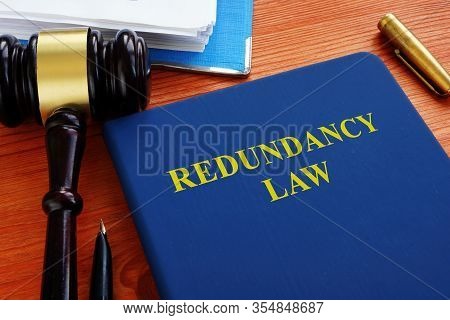 Redundancy Law Blue Book With Wooden Gavel.