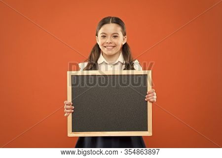 Happy Small School Girl With Chalkboard. Blackboard For Copy Space. Information. Write Hometask. Bac