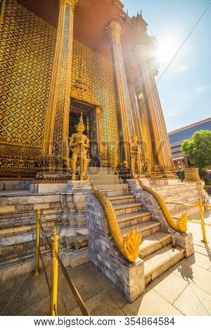 Temple Guardians And Staircase Outside Phra Mondop In Wat Phra Kaew Within Grand Palace Area In Brig