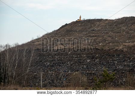 View Of The Mountain Dump With A Tractor