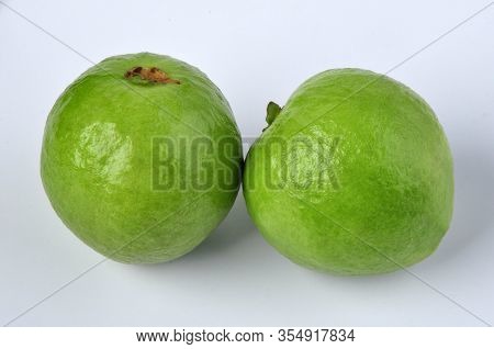 Group Of Red Guava Fruit In White Background