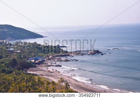 View Of The Beach With Ehite Waves Captured From The Air
