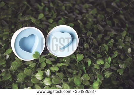 Focusan Easter Egg With A Heart Inside On The Grass. Eater Egg, Sign Of Easter S Day Festival. Close