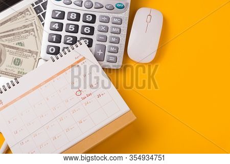 April Of The Year Is Tax Day, Top View Flat Lay Closeup Calculator, Laptop Computer, Calendar, And D