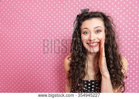Closeup Portrait Of Beautiful Young Kinky Woman In Pin-up Style, Wispering Some Secret To The Camera