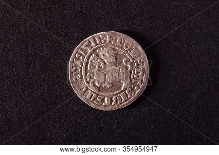 Old Grand Duchy Of Lithuania Coin  Half-grosz Isolated On The Dark Background