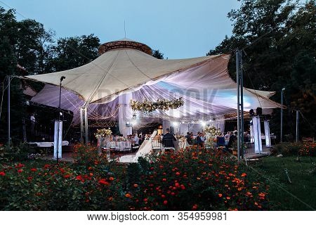Wedding Tent In The Evening In The Park. A Place To Celebrate The Bride And Groom In The Open Air.